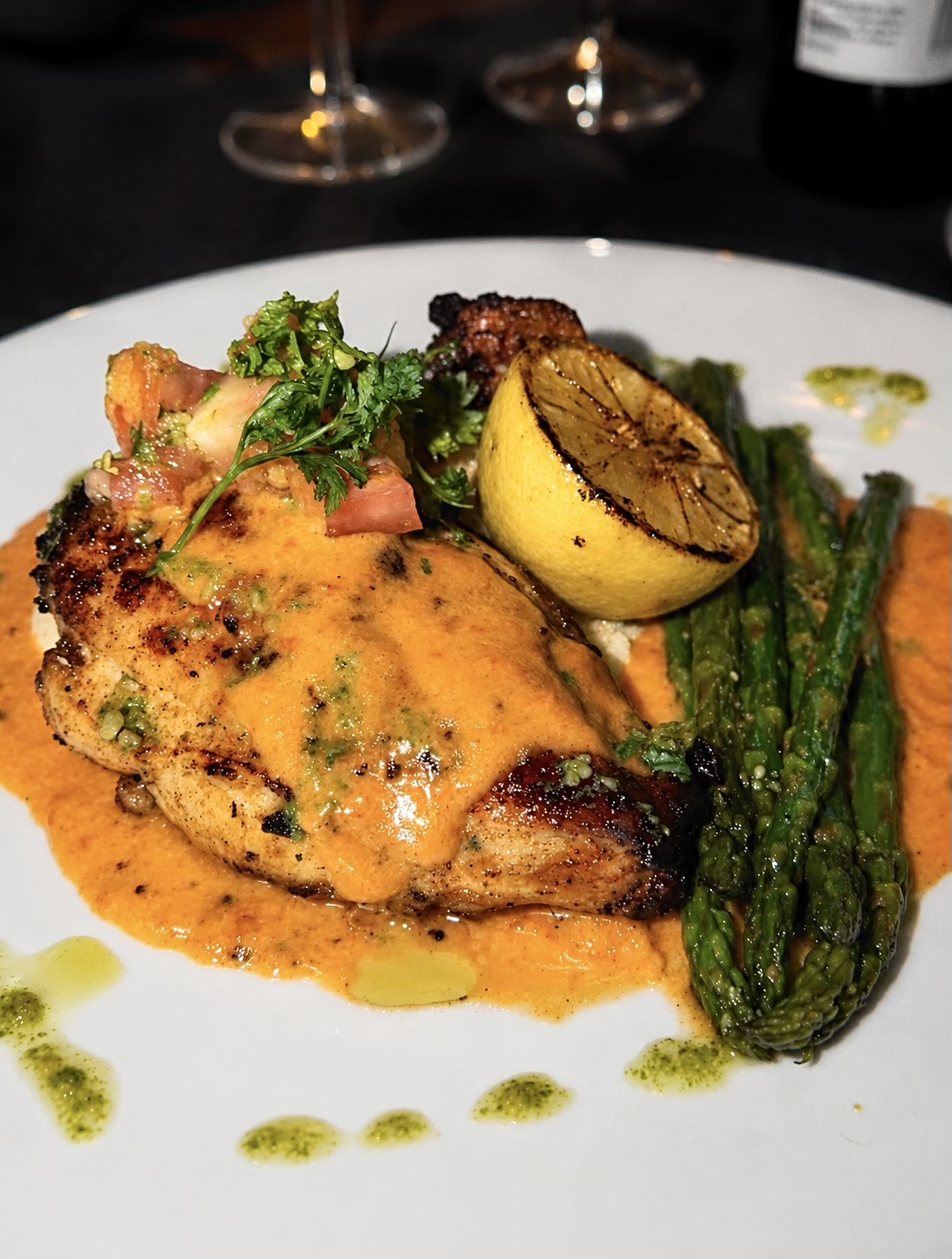 Plated chicken entrée with asparagus